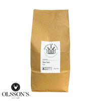 Kraft paper bag of Olsson's fine baking salt on a white background