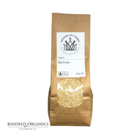 Kraft paper bag of Australian grown organic quinoa with Kindred Organics Tasmania branding on a white background