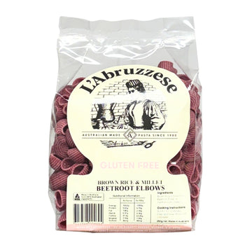 Packaged gluten-free brown rice and millet beetroot elbows pasta with L'Abruzzese branding.