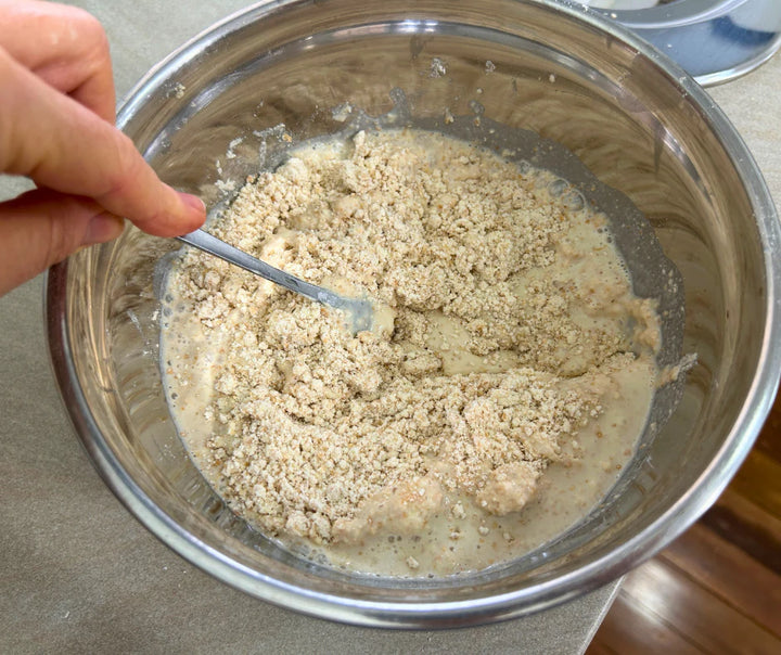 Adding milk into a dough made from freshly milled organic purple straw wheat for homemade wholegrain scones. Purple straw wheat is perfect for biscuits, cookies, cakes and scones. 