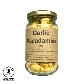 a jar of organic garlic roasted macadamias