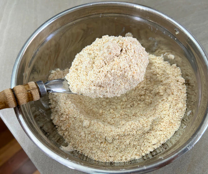 Butter having been mixed into freshly milled organic purple straw what for homemade scones, biscuits, cookies and cakes. 