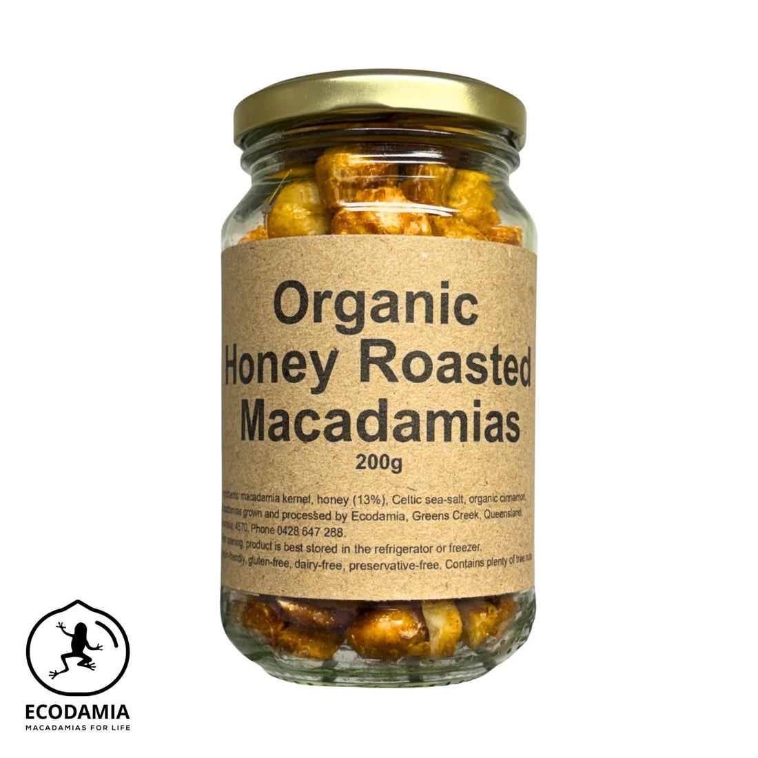 A glass jar of Ecodamia Organic Honey Roasted Macadamias, 200g, with a kraft paper label and a gold metal lid, shown on a white background with the Ecodamia logo in the bottom-left corner.