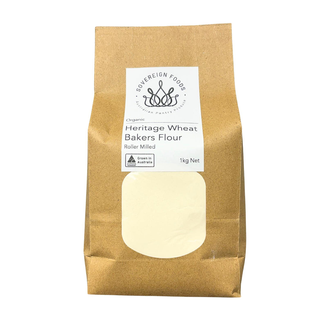 A 1kg bag of Sovereign Foods Heritage Wheat Bakers Flour in a brown kraft paper bag with a white label and a clear window showing the pale flour inside.