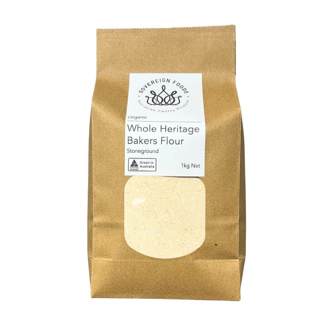 A 1kg bag Organic Whole Heritage Bakers Flour, shown in a brown kraft paper bag with a white label and a clear window displaying the pale flour inside.